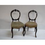 A set of 6 Victorian carved back and open Parlour Chairs, on front cabriole legs.