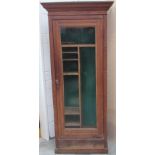 An Edwardian oak Gun Cabinet, the moulded cornice enclosing a secret compartment,