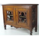 An unusual 19th Century Gothic Revival carved oak Side Cabinet, in the style of A.W.N.