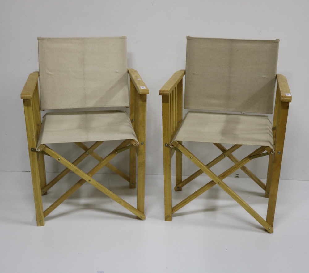 A set of 6 folding "Directors" Chairs, covered in cream linen fabric.