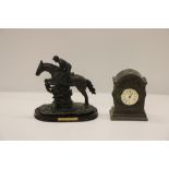 A composition Trophy of a Horse & Jockey, on wooden stand; a modern heavy metal Mantle Clock,