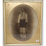 Cricket: An original oval Photograph on canvas, depicting a wicket keeper possibly Irish,