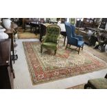 A large Oriental red ground Carpet, with large central panel and wide border with central design,