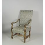 A large and impressive late 19th Century carved giltwood Armchair, with carved scroll arms,