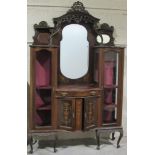 A late Victorian carved walnut mirror back Display Cabinet,