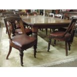 A large Edwardian walnut telescopic Dining Table, the moulded top with canted corners,