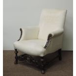 A unusual large Armchair, covered in cream cloth, with carved and pierced wooden frame,