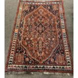 An attractive orange and blue ground Oriental Rug, with multiple borders,