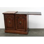 A Louis XV style walnut Side Cabinet / Buffet with hinged top over solid cupboard doors on a plinth
