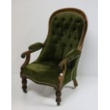 A good quality Victorian carved mahogany Armchair, with deep button back, covered in green velvet.