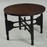 A large Oriental carved hardwood Occasional Table, with engraved and enamelled circular top,