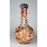 A large 19th Century Japanese tubular Vase, the main body with red ground decoration,