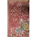 An attractive large heavy woolen pink ground Salon Carpet, with ornate floral bouquets, 18'2" x 12'.