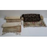 Four varied size woolen Mats or Rugs, with floral design and pattern.