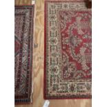 An attractive claret ground Oriental Carpet,