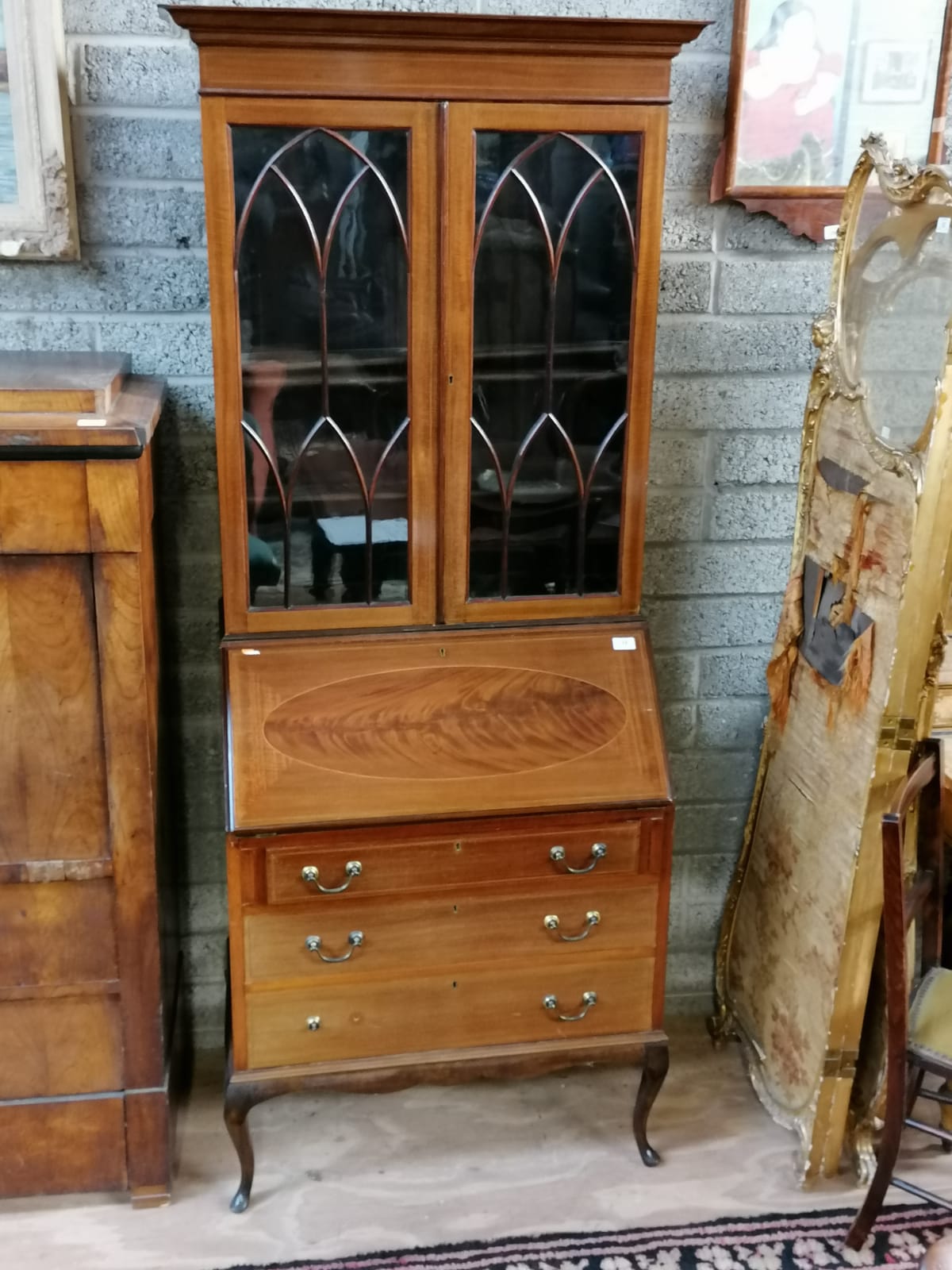 An Edwardian slope front Bureau, with fitted interior above three drawers raised on cabriole legs, - Image 2 of 6