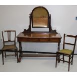 An attractive and good quality Victorian mahogany Dressing Table with carved back enclosing a swing
