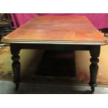 An Irish Victorian mahogany extending Dining Table, with two spare leaves, on shaped bulbous legs,