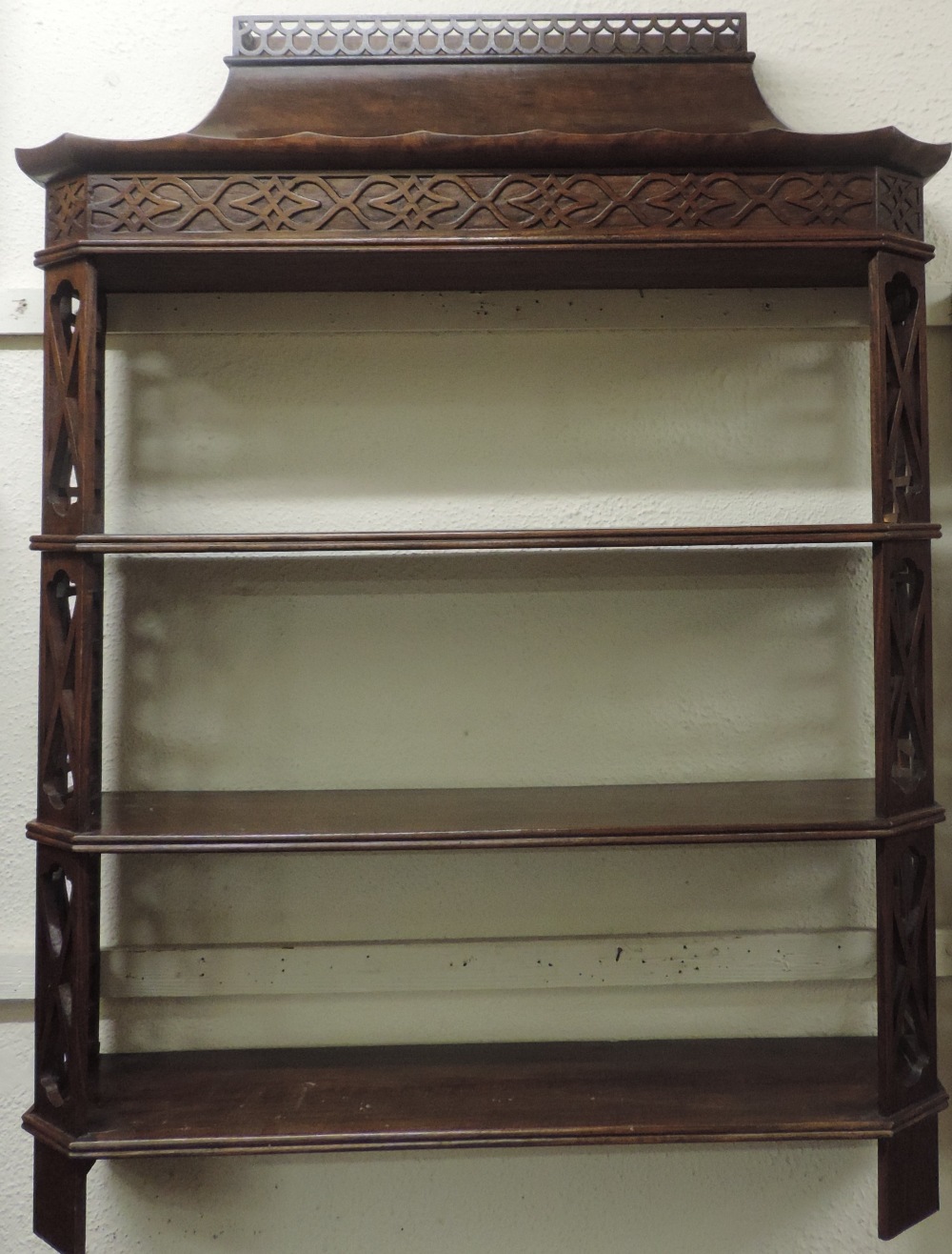 An attractive Chinese Chippendale style mahogany three shelf Wall Bracket,
