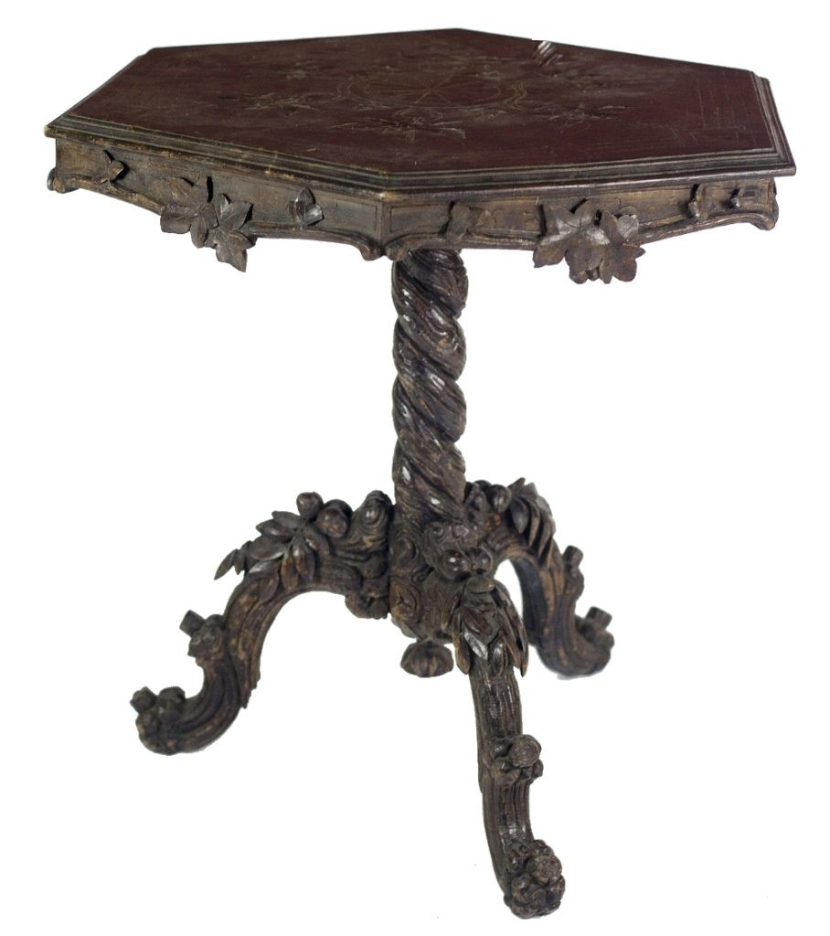 A 19th Century carved and stained oak hexagonal top Tripod Table,