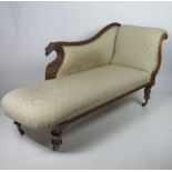 A William IV carved mahogany Chaise-Longue, with a shaped back decorated with carved eagle,