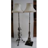 Two similar brass lamp Standards, with decoration in steel design, with cream shades.
