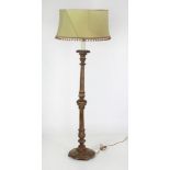 A giltwood Lamp Standard and shade, with turned and fluted upright, on circular base.