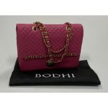 A pink leather Bodhi Handbag, with quilted design and gilded and leather intertwined straps,
