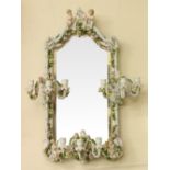 A Continental porcelain three branch Girandole Mirror, 19th Century,