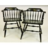 A pair of modern ebonised Barrack Room type Armchairs,