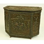 A large embossed brass Fuel Box, with scenes in relief after David Tenniers,