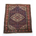 A fine heavy Sarouk Rug, West Iran with red and ivory centre medallion,