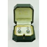 A fine quality pair of Tahitian pearl and diamond drop Ear-Rings, set with .