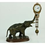 A fine bronzed model of an Elephant, with Clock, and with the pendulum hanging from trunk,