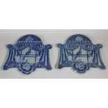 A pair of heavy blue and white porcelain Panels, each with a bird in a draped cage,