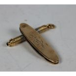 An 18ct gold (tested) small pendant type Pencil, approx. 11 gms.