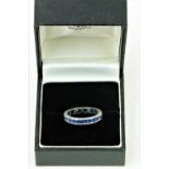 A Channel Set platinum Eternity sapphire Ring, set with .06 x 25 = 1.5 tcw, size J.
