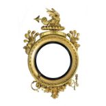 A magnificent Irish Regency period carved giltwood Convex Mirror, by R.W.