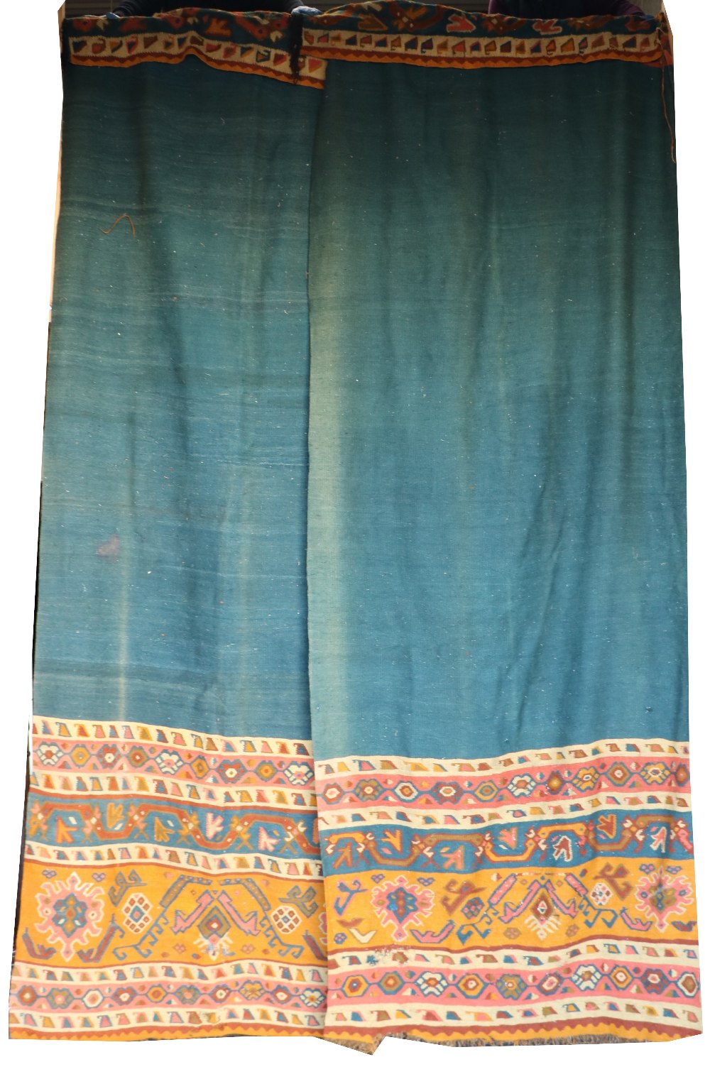 A set of 3 heavy tapestry style wool Curtains, each with iron red blue and yellow lower borders,