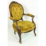 A Victorian carved walnut framed Armchair,