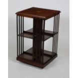 An inlaid mahogany Revolving Bookcase, with square moulded and crossbanded top and railed sides, (O.
