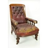 A large Irish 19th Century late Victorian carved oak Library Armchair, covered in red leather,