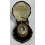 A 19th Century circular miniature Portrait, "A Lady," in gold frame,