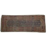 A semi-antique Oriental Runner, the dark blue ground with stylized field inside a multi band border,