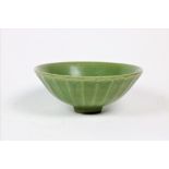 An 18th Century Chinese green crackleware Bowl, with leaf moulded outer body, 6 1/4" (16cms).