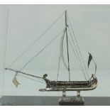 A silver miniature Model of a "Viking" type or "Greek" War Ship, with masts and oars,