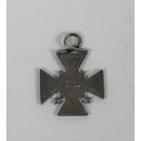 A 19th Century silver Medal for Merit, the cross shaped body with etched design,