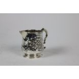 A silver Milk Jug, Dublin 1812, with "S" scroll handle, the body decorated with foliate design,