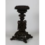 A very ornate Victorian highly carved rosewood Anglo Indian Jardiniere Stand,
