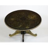 A Regency style ebonised and brass inlaid circular Low Table, with brass mounts,